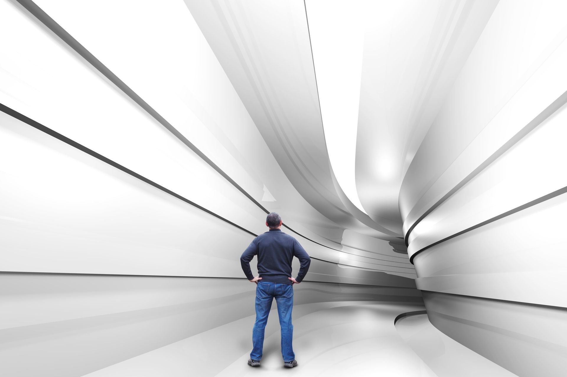 Man stands in a tunnel with a turn into the unknown Man stands in a tunnel with a turn into the unknown